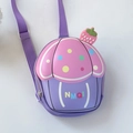 Detail view of pink and purple silicone cupcake bag with strawberry and woven strap - Purple