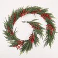 Detailed view of dense red berries and green pine needles on a spiral Christmas garland - T6108/180 Rattan (No Light)