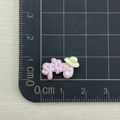 Close-up of pink resin cloud charm with spring text on a scale for size measurement - Pink Spring