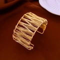 Artistic gold double-layer hollow woven wire cuff bracelet with open adjustable design - Gold Thick Wire Wrapped Hollow