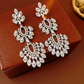 Detailed macro shot of vintage silver chandelier earrings with zircon flower tassels - Silver (Silver Pin) / Silver
