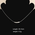 Silver twist tube pendant necklace on snake chain displayed on black jewelry bust - Curved Tube Necklace (Steel Color)