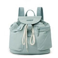 Detail of mint green nylon backpack showing large pockets and adjustable drawstring closure - Soft Mist Green