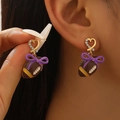 Detail of rugby enamel earring with heart stud and purple bow in sport style - Purple Bow Rugby Earrings (11117)