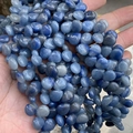 Macro shot of polished blue irregular natural crystal beads for DIY jewelry making - 10mmx12mm / Natural Blue Aventurine