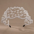 Macro detail of hand-woven crystal bridal headband with silver wire and white fabric wrap - Silver