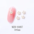 Detailed size view of 5x5mm white alloy flower nail charms with golden edges - White Flower (8487)
