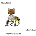 Cartoon enamel cat brooch with swinging fishbone pendant and floral pattern details - Yellow