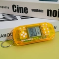 Mini handheld Tetris game keychain in transparent yellow with metal ring - Transparent Yellow