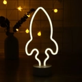 Rocket neon LED lamp in white glow with circular base for tabletop decoration - Rocket