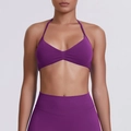 Close-up of purple seamless high-stretch halter sports bra and high-waisted leggings set - Plum Purple