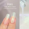 Translucent milky cyan nail gel polish F085 with shimmering glitter and gradient effect - F085 Emerald Moonlight