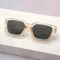 Close-up of translucent champagne thick-frame square sunglasses with dark grey lenses - Translucent Tea Frame Grey Lenses