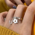 Silver ring with delicate white flower charm and clear crystal bead on finger - Pendant Charm