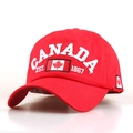 Red cotton baseball cap with white Canada embroidery and maple leaf on front view - M / Red