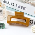 Medium amber jelly hair claw clip with hollow square design for daily hairstyling - Glossy Tan