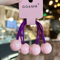Purple elastic hair ties set with glossy pink round beads on a display card - Pink