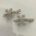 Pair of silver snowflake hair clips with sparkling rhinestones on white background - Rhinestone Snowflake Hair Clips (K-038) / Silver