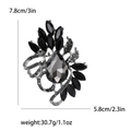 Vintage floral brooch with large grey teardrop crystal and black marquise gems - Gunmetal
