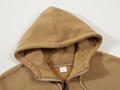 Brown oversized zip-up hoodie in soft fleece fabric showing hood and zipper detail - Brown