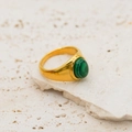 18k gold plated ring with green malachite gemstone inlay on a stone base - Malachite-toned Stone