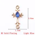 Light blue crystal cross pendant charm in KC gold plating, size 2.6cm x 1.3cm - 11791 Gold Light Blue