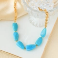 Golden chunky chain necklace featuring irregular blue marble stones on a white stand - Stainless Steel Marble Pattern Necklace / Blue