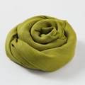 Elegant yellow-green cotton linen scarf rolled into a floral shape on white backdrop - 100*195CM / Autumn Yellow