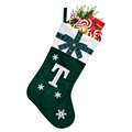 Close-up of green Christmas stocking with white snowflake patterns and embroidered letter T - Green T