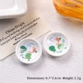 Macro shot of miniature 2.6cm porcelain dollhouse plates with red koi fish and lotus art - Small Size - Fish Playing in Lotus Leaves