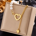 Elegant gold layered chain bracelet with pearls and hollow heart pendant on jewelry box - Hollow Heart Pearl Spliced Necklace (N1788)