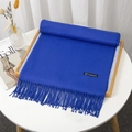 Royal blue cashmere-feel thick scarf with tassels displayed on a wooden tray - Royal Blue