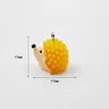 Detailed view of yellow acrylic hedgehog pendant with 17mm dimension and metal loop - Hedgehog