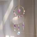 Close-up of rainbow suncatcher with purple amethyst crystals and faceted glass ball - Amethyst