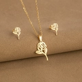 Detailed view of gold rose flower jewelry set including necklace and earrings - Rose