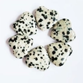 Polished spotted natural stone heart ornaments arranged in a circle on white background - Spotted Stone