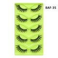 Detailed view of 5 pairs of black fox-eye cat-eye false eyelashes in a light green tray - Western Dense Style (8AF-35)