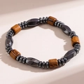 Detail of beaded men's bracelet with hematite stones and cylindrical wooden beads - Style 003 Geometric Hematite