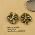 Macro view of vintage bronze heart pendant with bow relief and 18x16mm size scale - A1479-18*16MM