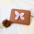 Brown mini coin purse with polka dot bow and plush ball keychain in a chic design - Brown