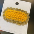Handmade crochet hair clip in bright yellow with gold edge trim on display card - 16# Gold Thread Oval Yellow