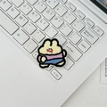 Close-up of a cartoon rabbit embroidery patch with detailed texture on a white keyboard - Apricot Rabbit