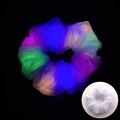 Macro shot of colorful LED mesh scrunchies glowing brightly in a dark setting - Mesh White