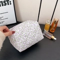 Quilted floral makeup bag in white with purple flowers and green leaf pattern - Purple Floral