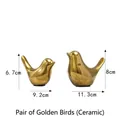 Pair of minimalist golden ceramic bird ornaments in small and large sizes - A Pair Of Golden Birds