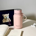Pink matte stainless steel vacuum flask with portable silicone handle and bottle text - 650ml / Pink