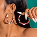 Detailed view of handmade polymer clay Christmas hoop earrings with Santa pendant - Red Green White Clay Hoop with Santa