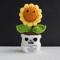 Handmade crochet sunflower with emotional support message in a white skull-shaped flower pot - Halloween Smiley Sunflower