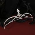 Elegant silver bridal crown with shimmering rhinestones and a central pearl detail - Style HG-081