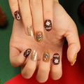 Festive Christmas press-on nails featuring snowflakes, candy canes, and gold glitter designs - Red Camel Matte Embossed Style (JP2782)